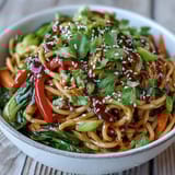 Colorful stir-fried bok choy, bell pepper, and snow peas tossed with shirataki noodles in a glossy ginger sauce.
