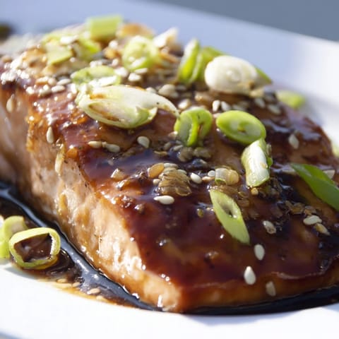 A perfectly cooked, flaky Honey Garlic Salmon fillet with a rich, sweet and savory sauce.