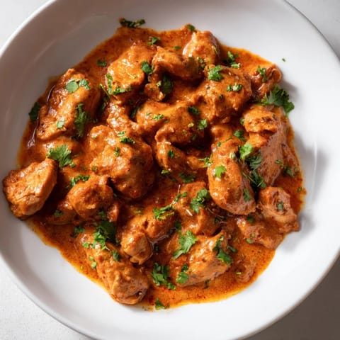 Fragrant Chicken Tikka Masala, the Indian-American favorite, with visible chunks of marinated chicken in sauce.