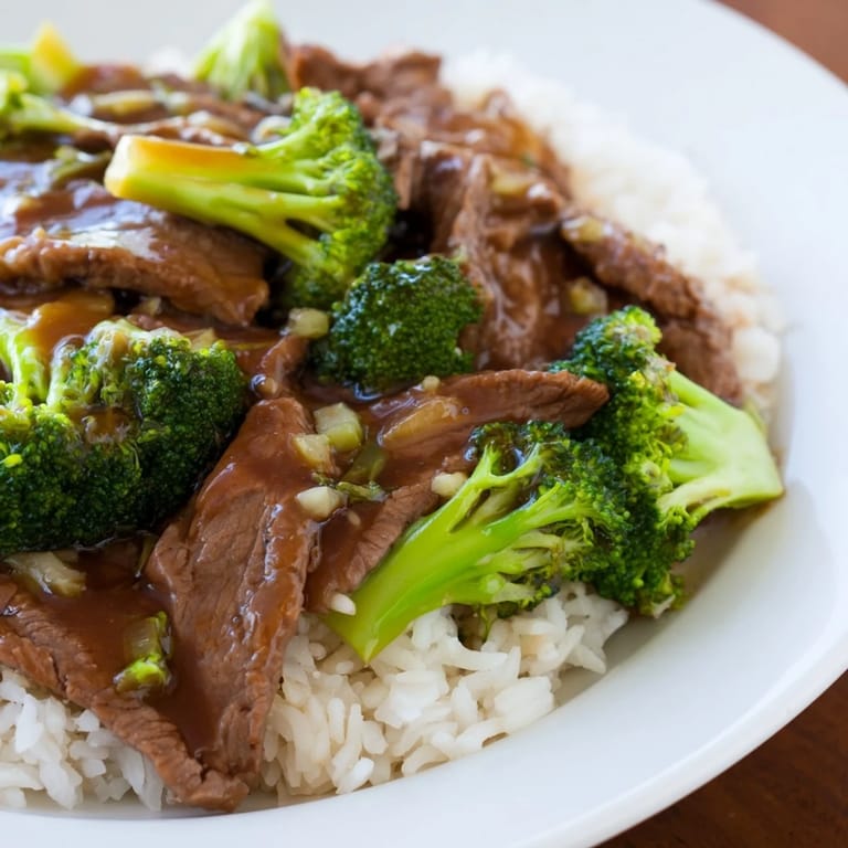 Savor the savory aroma of this homemade Beef and Broccoli with sauce-covered ingredients.
