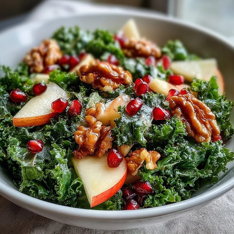 Serve this Kale and Pomegranate Bowl for a quick 15-minute vegetarian lunch, pairing the tart pomegranate and sweet apple with creamy feta or grilled chicken.